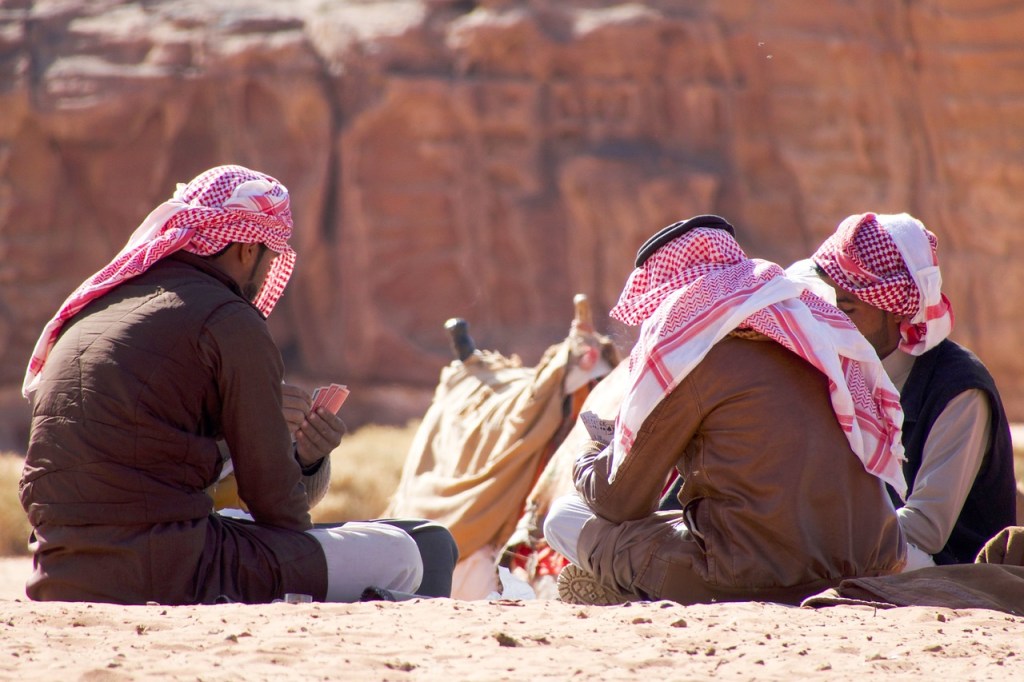 Group of Bedouin man playing cards